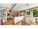 Charming kitchen featuring wooden cabinetry and dining area with natural light at 396 E Warren Ave, Denver, CO 80210
