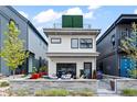 Modern two-story home featuring a sleek design and a welcoming patio area, plus a rooftop terrace at 3540 Pecos St, Denver, CO 80211