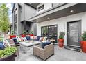 Inviting front porch with comfortable seating around a stone fire pit at 3540 Pecos St, Denver, CO 80211