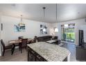 Modern kitchen with granite countertops and stainless steel appliances at 4100 Albion St # 501, Denver, CO 80216