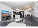 Open concept living area with kitchen and dining space at 4100 Albion St # 501, Denver, CO 80216