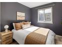 Cozy bedroom featuring stylish decor, neutral tones, and ample natural light from a bright window at 3251 N Madison St, Denver, CO 80205