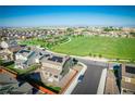Aerial view of neighborhood near open space and parks in suburban setting at 16188 Elizabeth St, Thornton, CO 80602