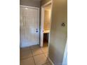Tiled entryway showing the front door and a doorway leading to an adjacent room at 14751 E Tennessee Dr # 222, Aurora, CO 80012
