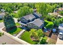 Aerial view of a home highlighting its landscaping, patio area, and overall neighborhood setting at 1750 E Noble Pl, Centennial, CO 80121