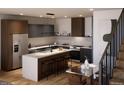 Modern kitchen with sleek countertops, stainless steel appliances, and island with seating at 5770 W 92Nd Ave, Westminster, CO 80031