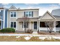 Inviting home exterior with covered porch and manicured landscaping; shows great curb appeal at 19709 Rosewood Ct, Parker, CO 80138