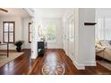Bright foyer with hardwood floors, decorative inlays, and ample natural light at 2502 Alton St, Denver, CO 80238