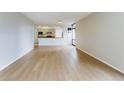 Open floor plan with hardwood floors that connects living area and kitchen at 1625 Larimer St # 1001, Denver, CO 80202