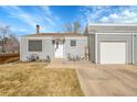 Inviting single-Gathering home with neutral siding, attached garage, and a walkway to the front door at 16403 E Radcliff Pl # A, Aurora, CO 80015