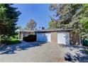 Spacious home with a two-car garage and a well-maintained concrete driveway at 3561 Kalispell St, Aurora, CO 80011
