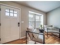 Cozy sitting room with hardwood floors, natural light, and comfortable seating at 18159 E Crestline Cir, Centennial, CO 80015