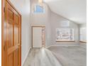 Spacious foyer with soaring ceilings and large windows providing ample natural light at 5857 S Zante Cir, Aurora, CO 80015