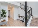 Inviting foyer with a view of the staircase, table and accent decor at 10157 W 38Th Ave, Wheat Ridge, CO 80033