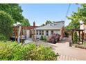 Backyard oasis with a spacious deck, pergola, and lounge seating perfect for relaxation at 4729 W 32Nd Ave, Denver, CO 80212