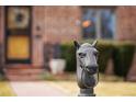 Close-up of charming horse head hitching post on the walkway to the beautiful brick home at 945 Niagara St, Denver, CO 80220