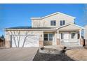 Two-story house with solar panels, attached garage, and landscaped front yard at 1965 E 127Th Cir, Thornton, CO 80241