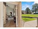 Welcoming entryway with wood floors, modern decor, and a glimpse of the bright, open living space at 1140 Magic Lamp Way # 4, Monument, CO 80132