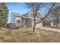 Two-story home featuring well-maintained landscaping, a classic design, and a welcoming entrance at 5130 S Wenatchee St, Aurora, CO 80015