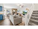 Cozy living room with a fireplace, natural light, and easy access to the staircase at 1080 S Yampa St, Aurora, CO 80017