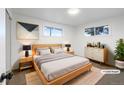 Cozy bedroom featuring a modern bed frame, soft lighting, and neutral decor, creating a relaxing atmosphere at 1153 Sherman St, Longmont, CO 80501