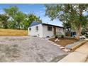 Inviting exterior showcasing a well-maintained home with modern updates and a spacious gravel driveway at 5573 S Huron St, Littleton, CO 80120