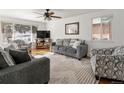 Bright living room with hardwood floors and comfy seating at 6631 E Ithaca Pl, Denver, CO 80237