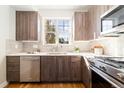 Modern kitchen with stainless steel appliances and wood cabinets at 2828 N Federal Blvd, Denver, CO 80211