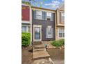 Charming townhome with blue shutters and a landscaped front, offering a welcoming entrance at 11923 E Ford Dr, Aurora, CO 80012