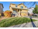 Two-story house with attached garage and landscaping at 14389 E 101St Pl, Commerce City, CO 80022