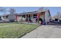 House exterior showcasing a well-maintained lawn and driveway at 6651 Albion St, Commerce City, CO 80022