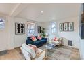 Comfortable living room showcasing contemporary decor, natural light, and stylish furnishings at 2572 Chase St, Edgewater, CO 80214