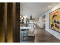 Modern dining room with white table and unique lighting at 3525 E 7Th Avenue Pkwy, Denver, CO 80206