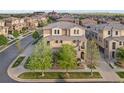 Attractive home with a stone and stucco facade, landscaped front yard, and inviting walkway in a suburban setting at 3291 Cascina Cir # D, Highlands Ranch, CO 80126