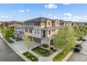 Stunning home featuring a blend of stone and stucco with well-kept lawns and a two-car garage at 3291 Cascina Cir # D, Highlands Ranch, CO 80126