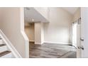 Bright living room with neutral paint, wood-style flooring and a vaulted ceiling at 17004 E Tennessee Dr # 212, Aurora, CO 80017