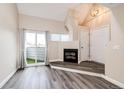 Living room features a fireplace, balcony, and a vaulted ceiling at 17004 E Tennessee Dr # 212, Aurora, CO 80017