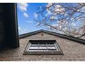 Close-up view of the detailed brickwork around the window and eaves at 10 Cherry St, Denver, CO 80220