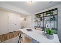 Spacious home office with a view of the upstairs and a large bookshelf at 45008 Sunflower Ln, Bennett, CO 80102