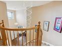 Beautiful staircase with crystal chandelier and high ceilings, providing a grand entrance at 7141 Red Mesa Dr, Littleton, CO 80125