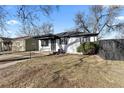 Charming single story home with neutral paint, landscaped yard and walkway at 1973 Alton St, Aurora, CO 80010