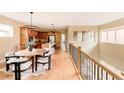 Modern kitchen features a spacious island, stainless steel appliances, and an adjacent dining area at 2940 Ulster St, Denver, CO 80238