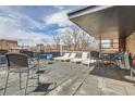 The rooftop deck shows an open-air lounge featuring plenty of seating and panoramic city views at 500 E 11Th Ave # 305, Denver, CO 80203
