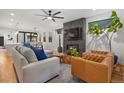 Inviting living room with modern fireplace, plush seating, and a bright, open layout at 3928 Vrain St, Denver, CO 80212