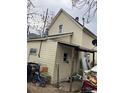 A view of the backyard with a covered patio and a detached garage at 615 E 49Th Ave, Denver, CO 80216