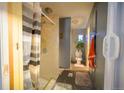 Bathroom featuring a stand up shower, toilet, neutral flooring, and fixtures at 15682 Morris Ave, Fort Lupton, CO 80621