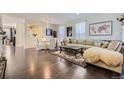 Bright living room featuring hardwood floors, modern furniture, and stylish decor, creating a welcoming atmosphere at 4827 S Coors Ln, Morrison, CO 80465