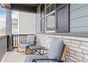 Inviting front porch with comfortable seating area at 23998 E Atlantic Pl, Aurora, CO 80018