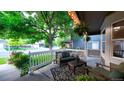 Inviting front porch with comfortable seating, decorative plants, and a cozy atmosphere for outdoor relaxation at 5150 Morning Glory Pl, Highlands Ranch, CO 80130
