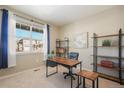 Well-lit office space with a large window and modern furnishings at 2159 Indian Balsam Dr, Monument, CO 80132